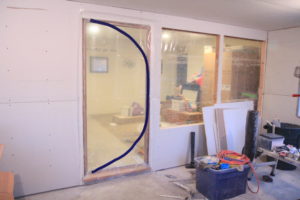 dust containment door guard