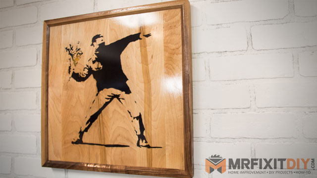 wooden banksy wall art